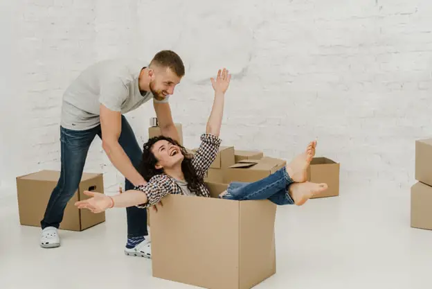 man and woman with box
