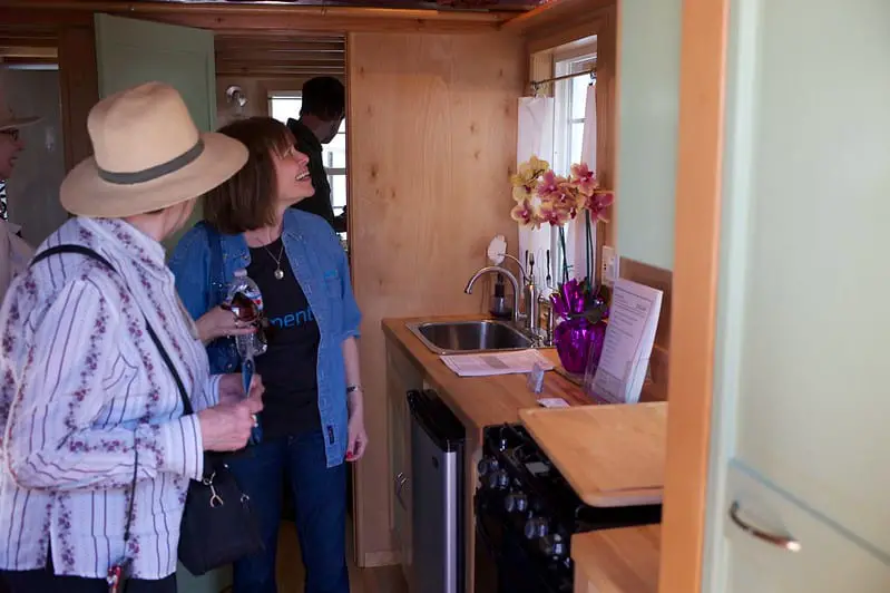 group of people inside tiny house