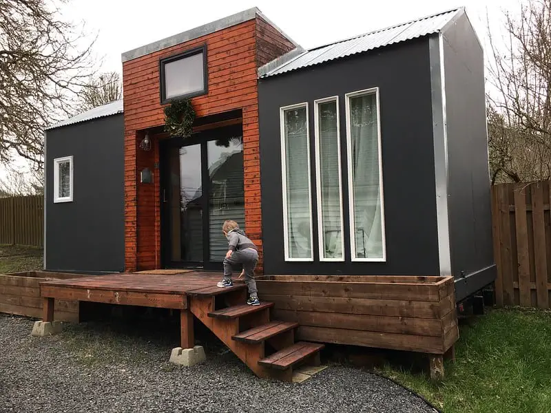 kid walking in the stair of tiny house